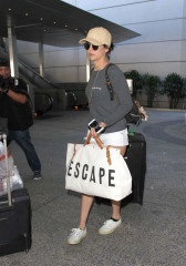 Nina Dobrev in Shorts Arriving at LAX Airport in LA фото №945830