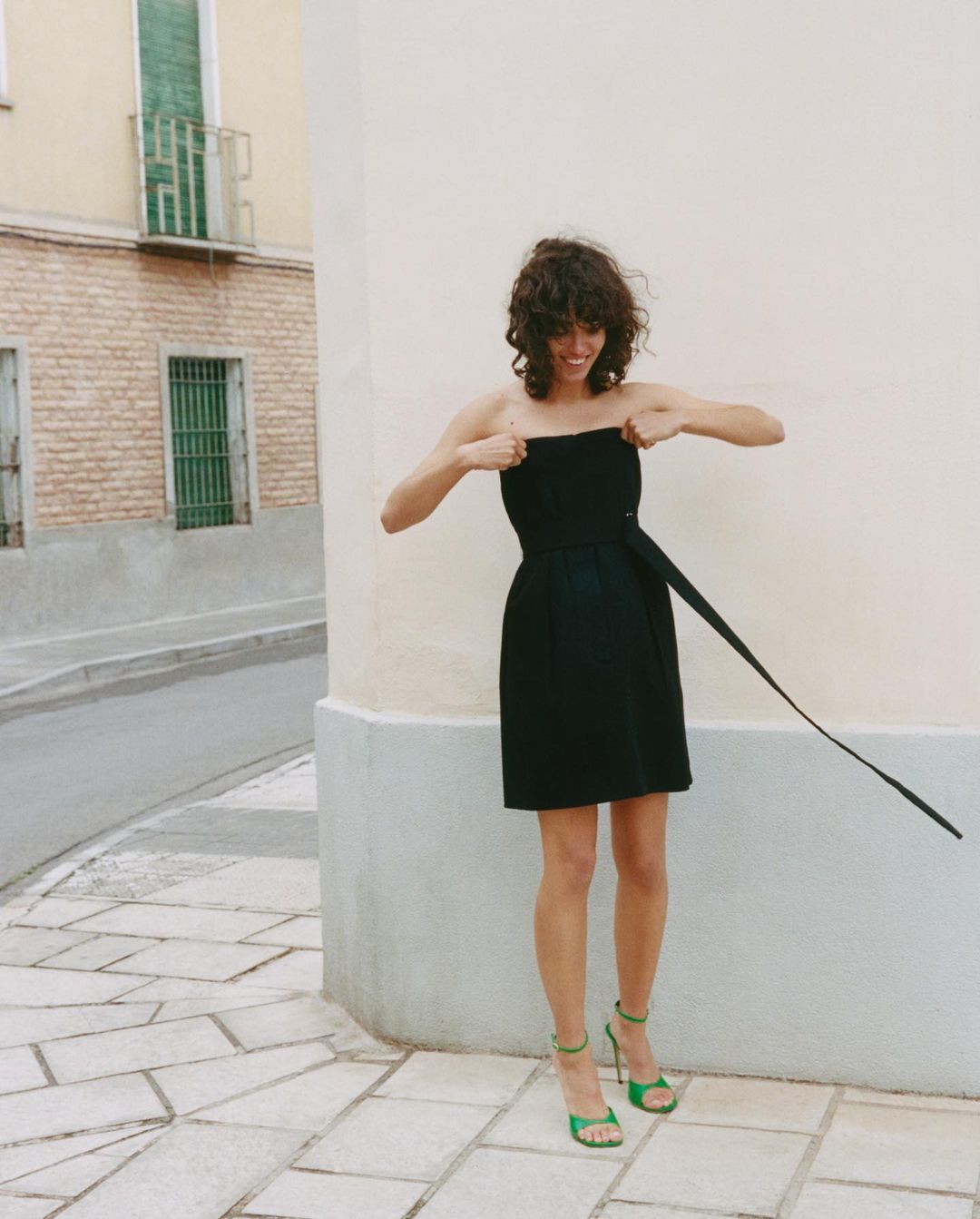 The return of the little black dress ????@guindideguindilla wears the Strapless Mini Dress in Black and the  Destiny Sandal 90mm in Green
